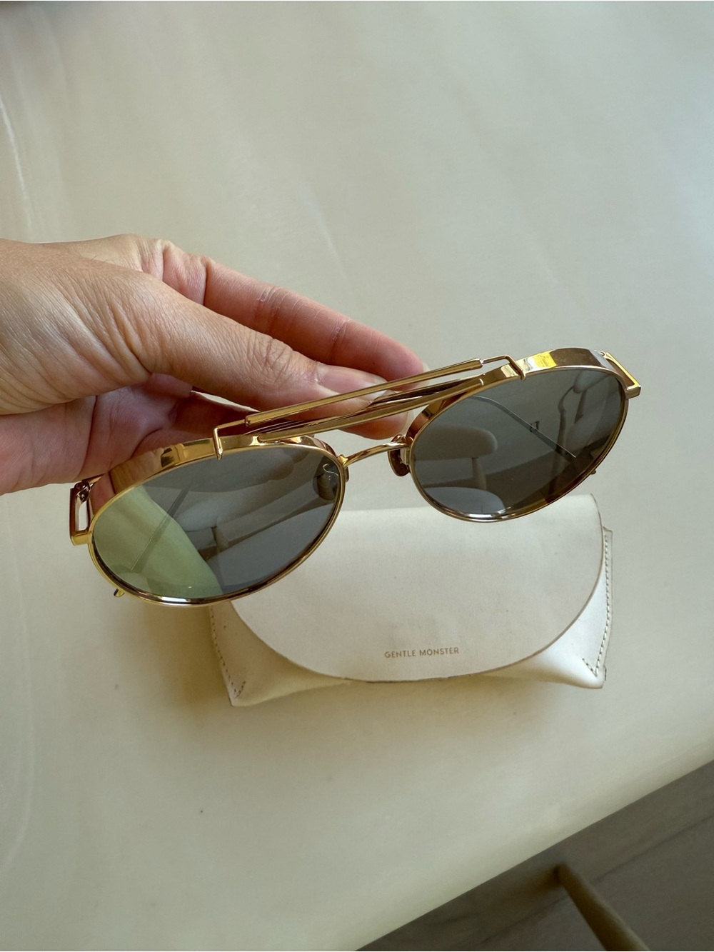 GENTLE MONSTER Gold Frame Sunglasses with Green-Tinted Dark Lenses